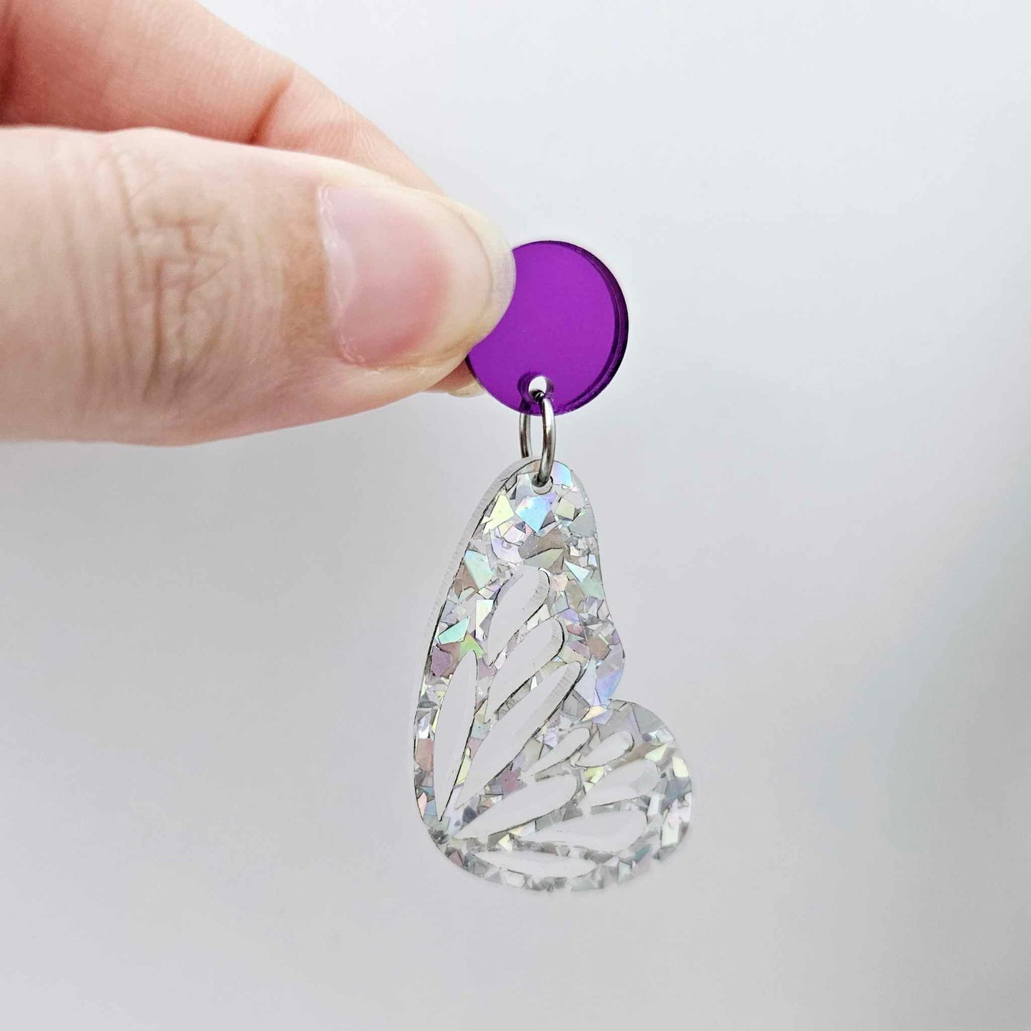purple mirror earring toppers paired with silver glitter butterfly wing dangles