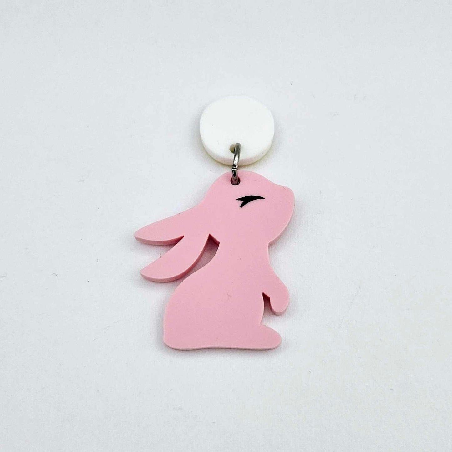 32mm Pastel pink bunny dangle blanks showing paint filled black eyelashes on two pieces, with remaining pieces shown with protective paper as supplied