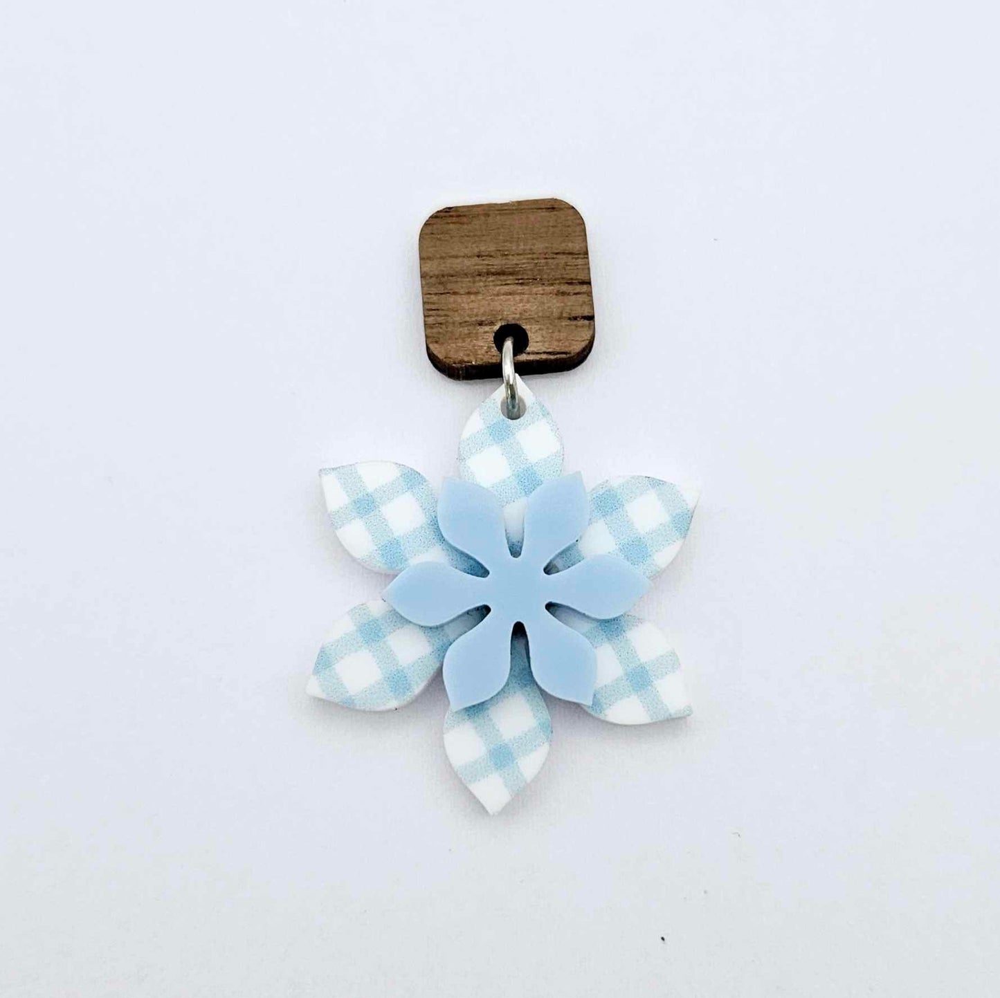Layered blue gingham UV print and pastel blue acrylic flower dangle assembled and hanging from a 12mm walnut wood topper, 3D two tone floral design