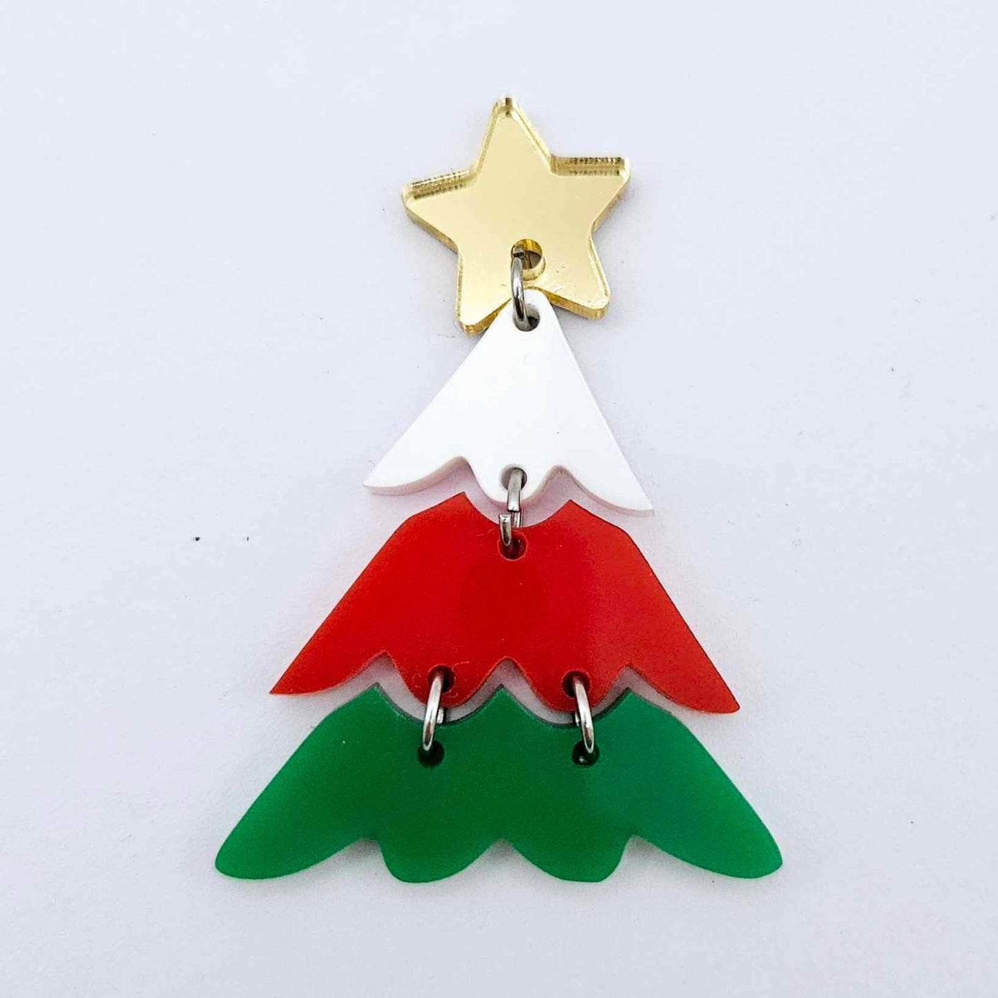 One green, red and white three piece Christmas Tree dangle earring blanks assembled with jump rings and a star topper