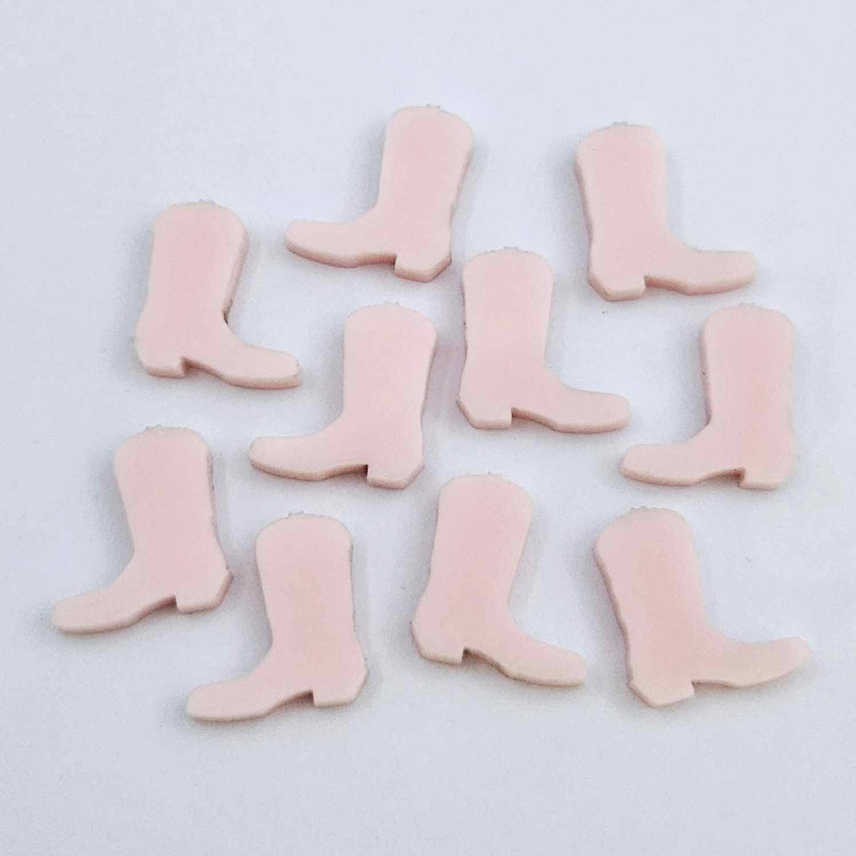 15mm strawberry milkshake pink acrylic boot stud earring blanks laid flat with a white background.