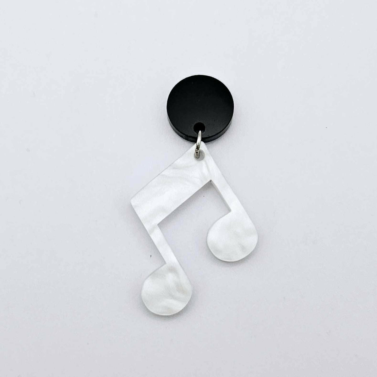 35mm white marble acrylic music note earring dangle blank assembled with a 14mm black topper, showing the lightweight finished earring design.
