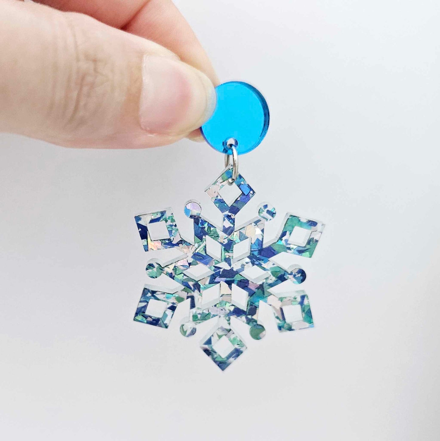 blue mirror earring toppers paired with blue/silver glitter snowflake dangles