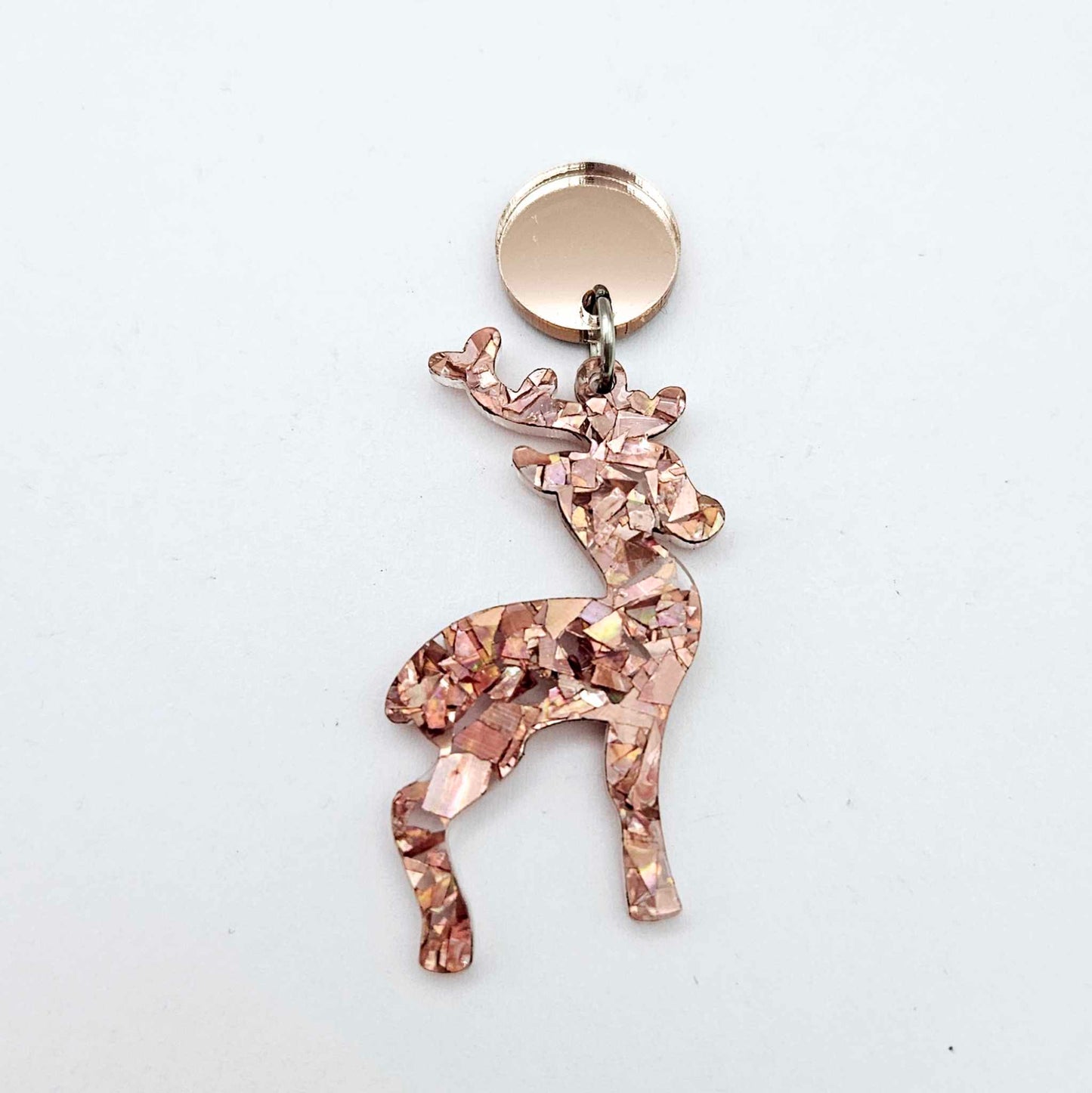 Rose gold mirror earring toppers paired with Christmas reindeer dangles for festive earrings