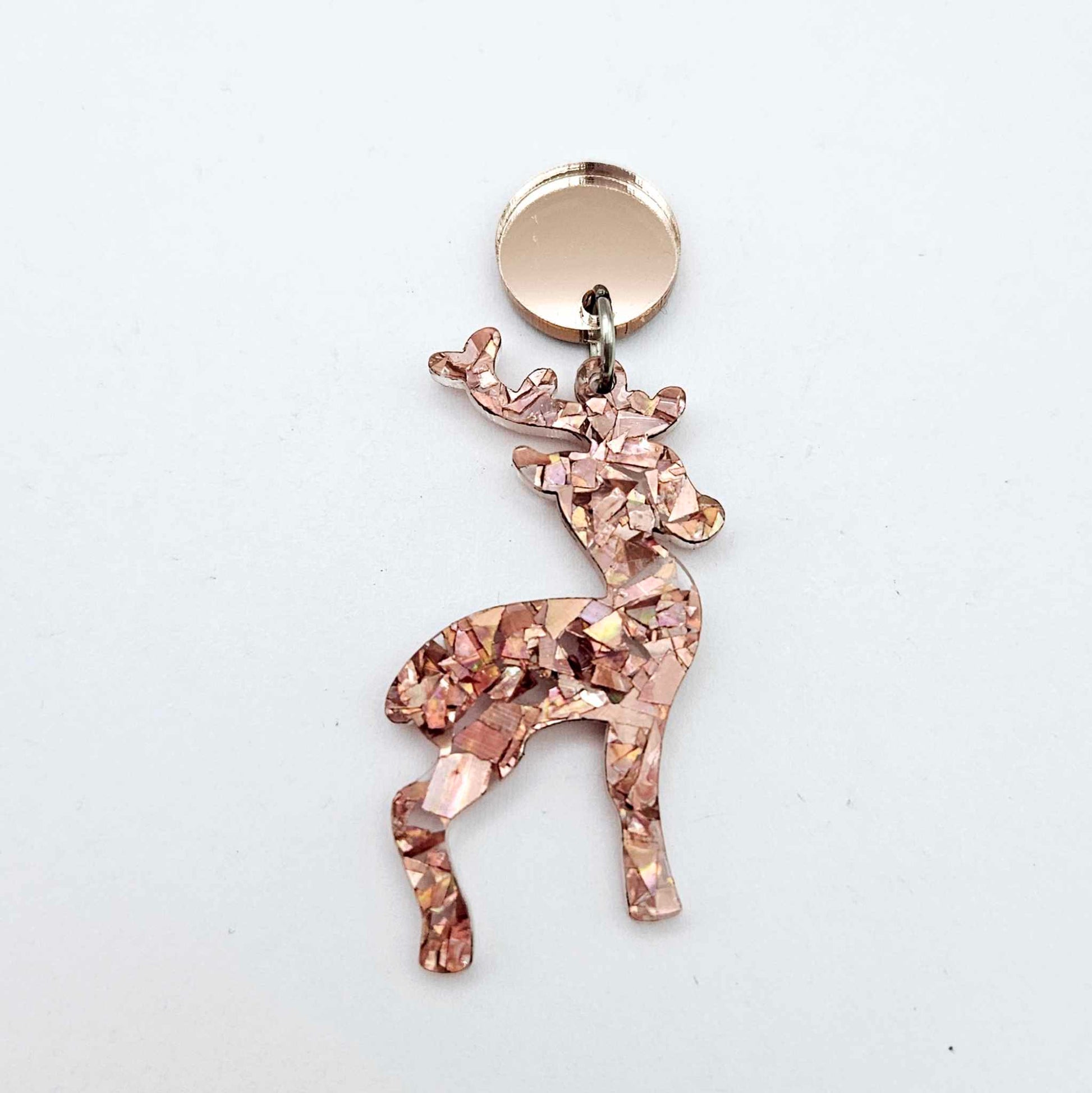 Rose gold mirror earring toppers paired with Christmas reindeer dangles for festive earrings