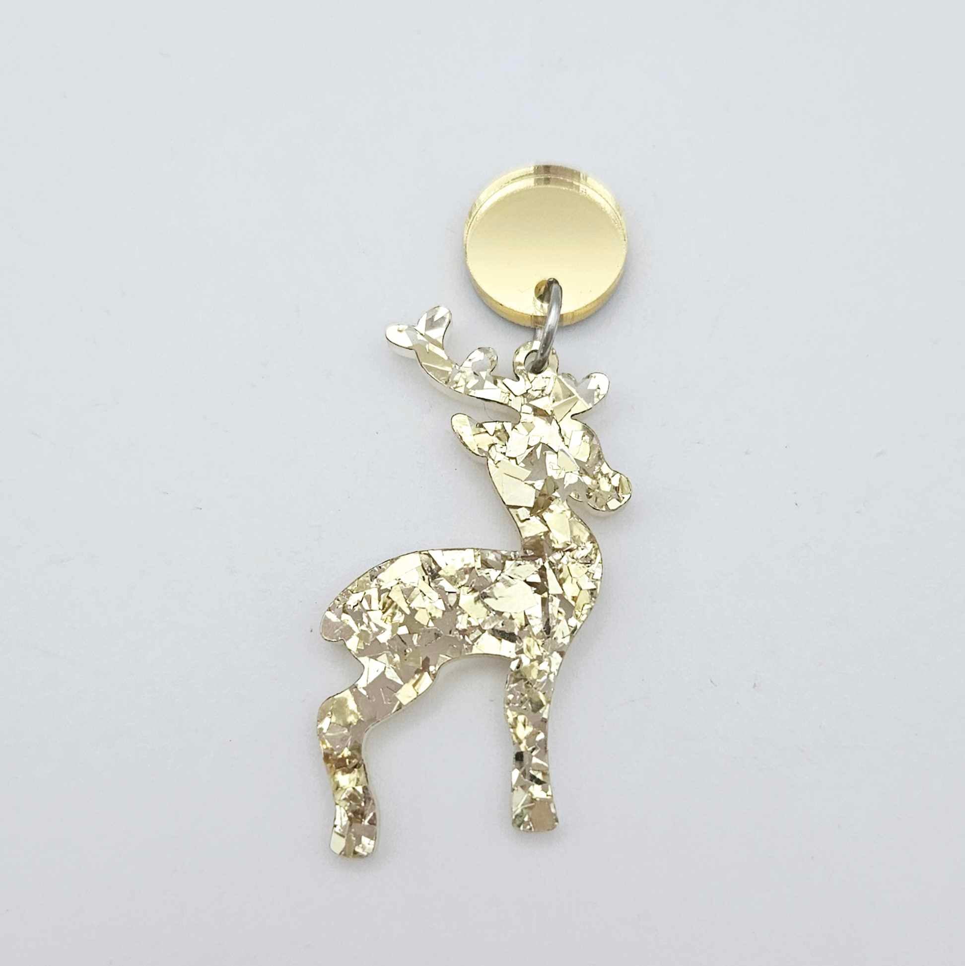 gold mirror earring toppers paired with Christmas reindeer dangles for festive earrings