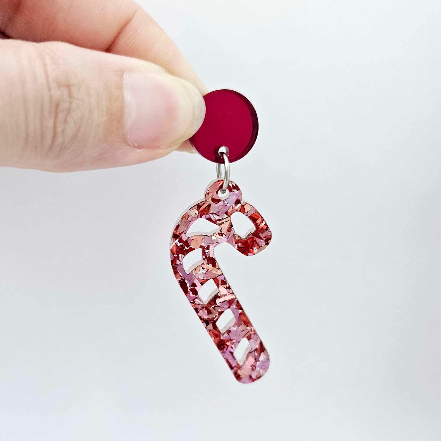 red mirror earring toppers paired with Christmas candy cane dangles for festive earrings