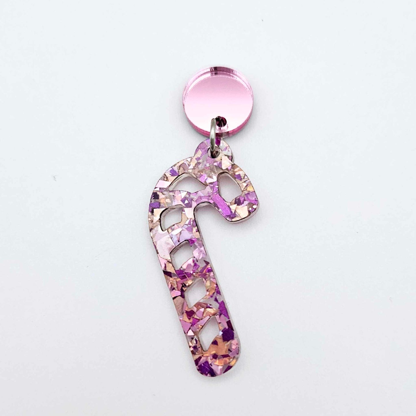 pink mirror earring toppers paired with Christmas candy cane dangles for festive earrings