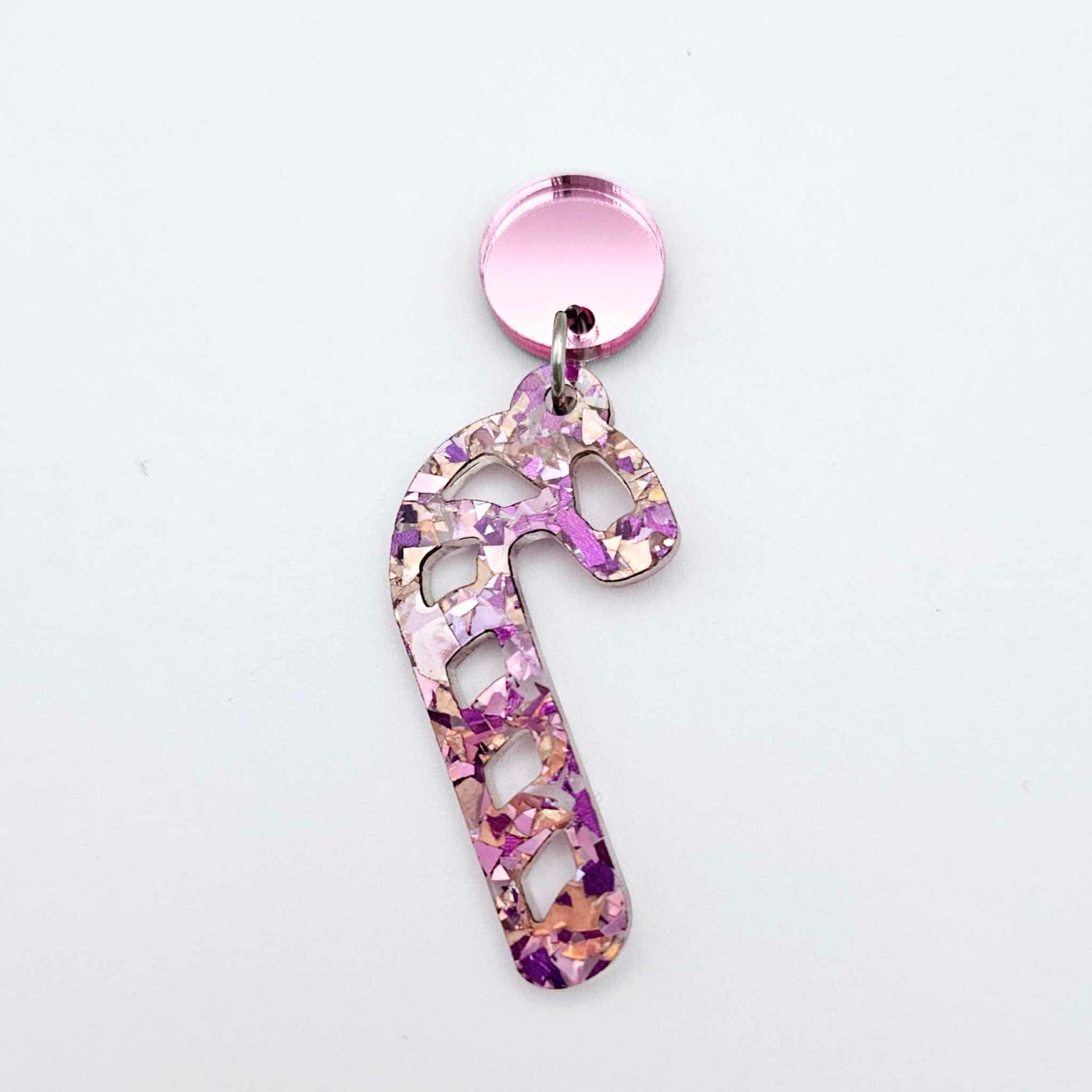 pink mirror earring toppers paired with Christmas candy cane dangles for festive earrings
