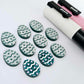16mm teal glitter acrylic Easter egg stud blanks with engraved pattern and paint fill