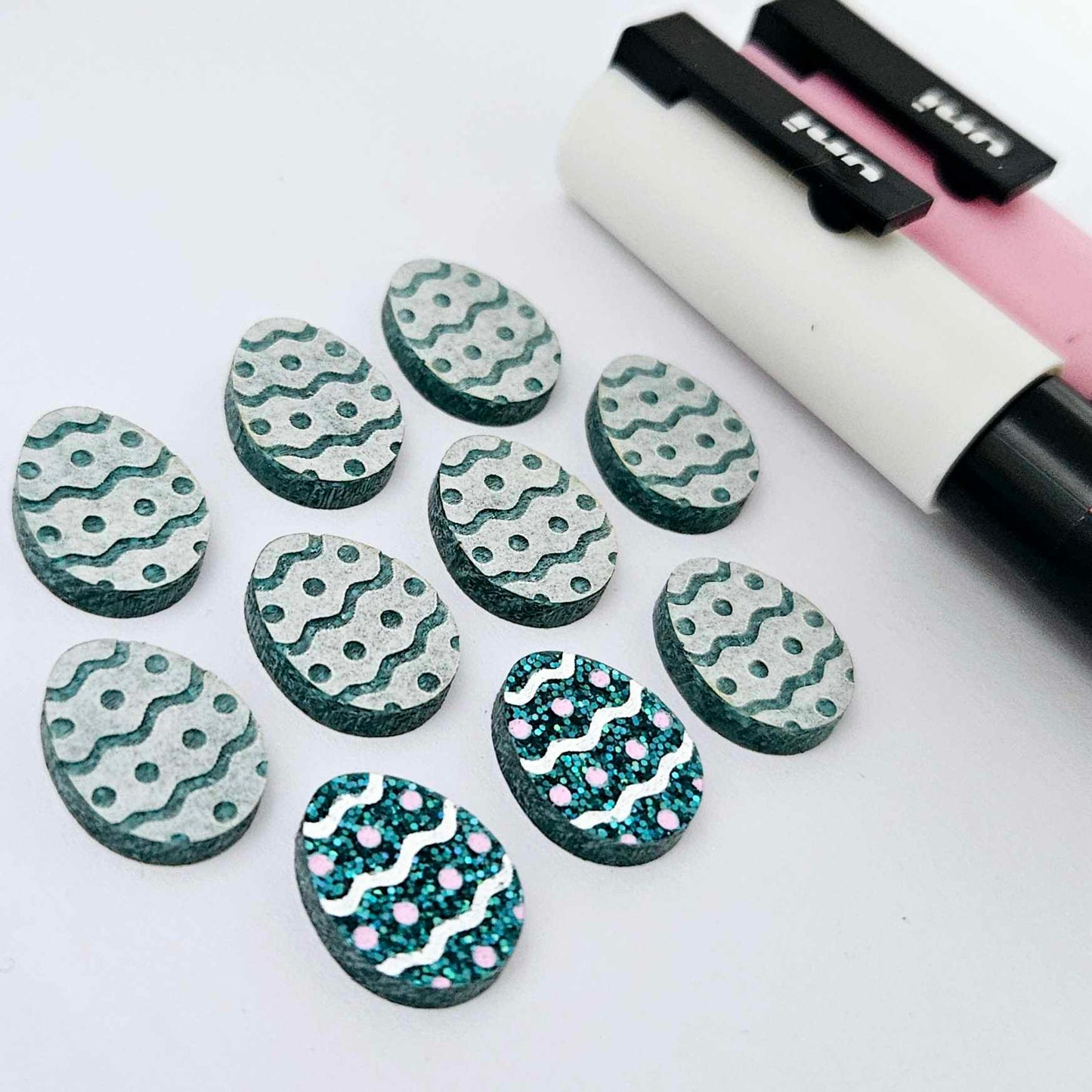 16mm teal glitter acrylic Easter egg stud blanks with engraved pattern and paint fill