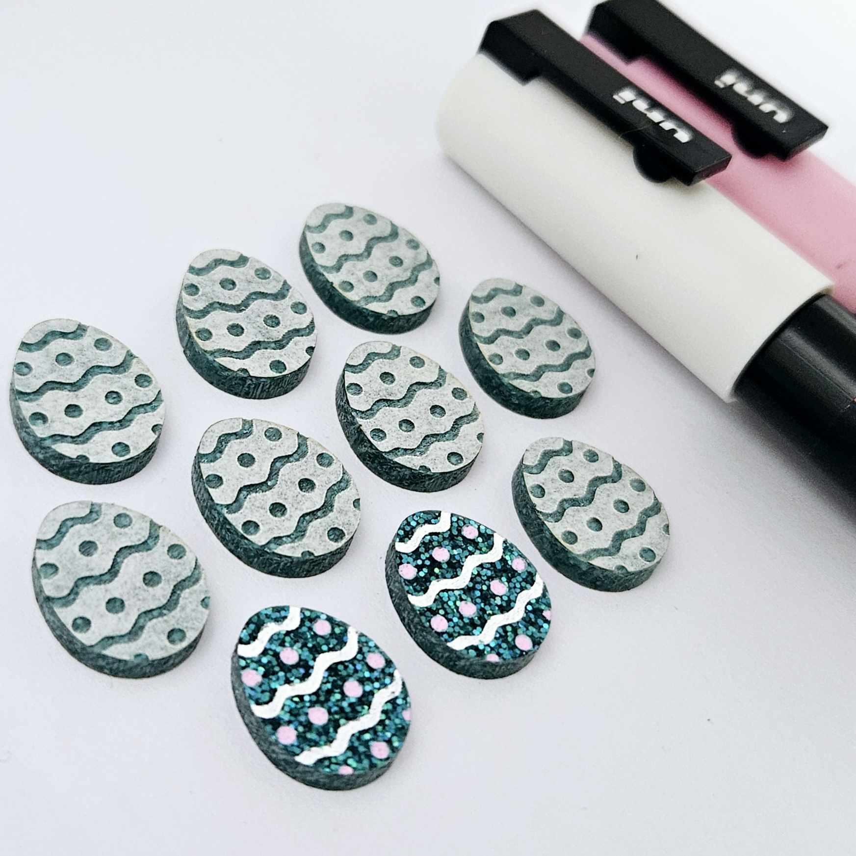 16mm teal glitter acrylic Easter egg stud blanks with engraved pattern and paint fill