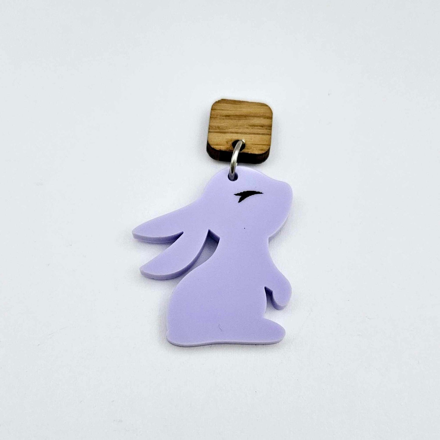 32mm pastel purple bunny dangle blanks showing paint filled black eyelashes hanging from 12mm oak wood square topper