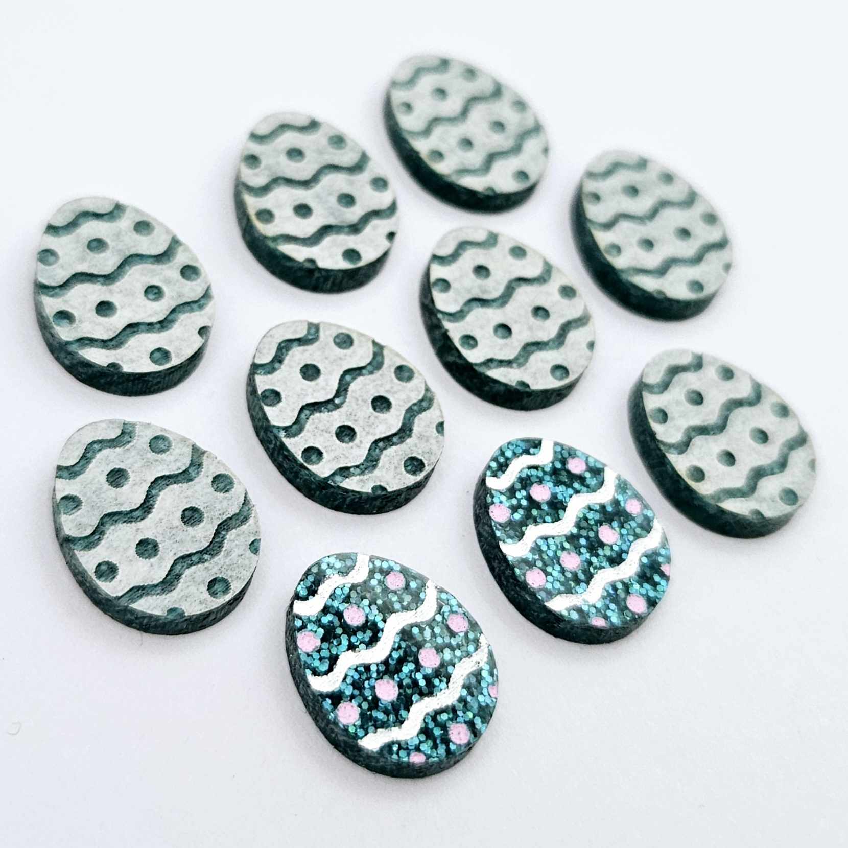 16mm teal glitter acrylic Easter egg stud blanks with engraved pattern and paint fill