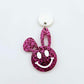 Hot pink glitter acrylic bunny dangle earring blank hanging from a 14mm white acrylic topper, bunny head with floppy ear and paint filled smiley face