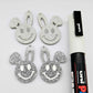 38mm silver glitter acrylic bunny dangle blanks with engraved smiley face, two paint filled white and two others unfilled with protective film on, shown with a White Posca paint pen
