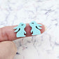 Close-up of pastel aqua acrylic bunny stud blanks with paint filled eyelashes