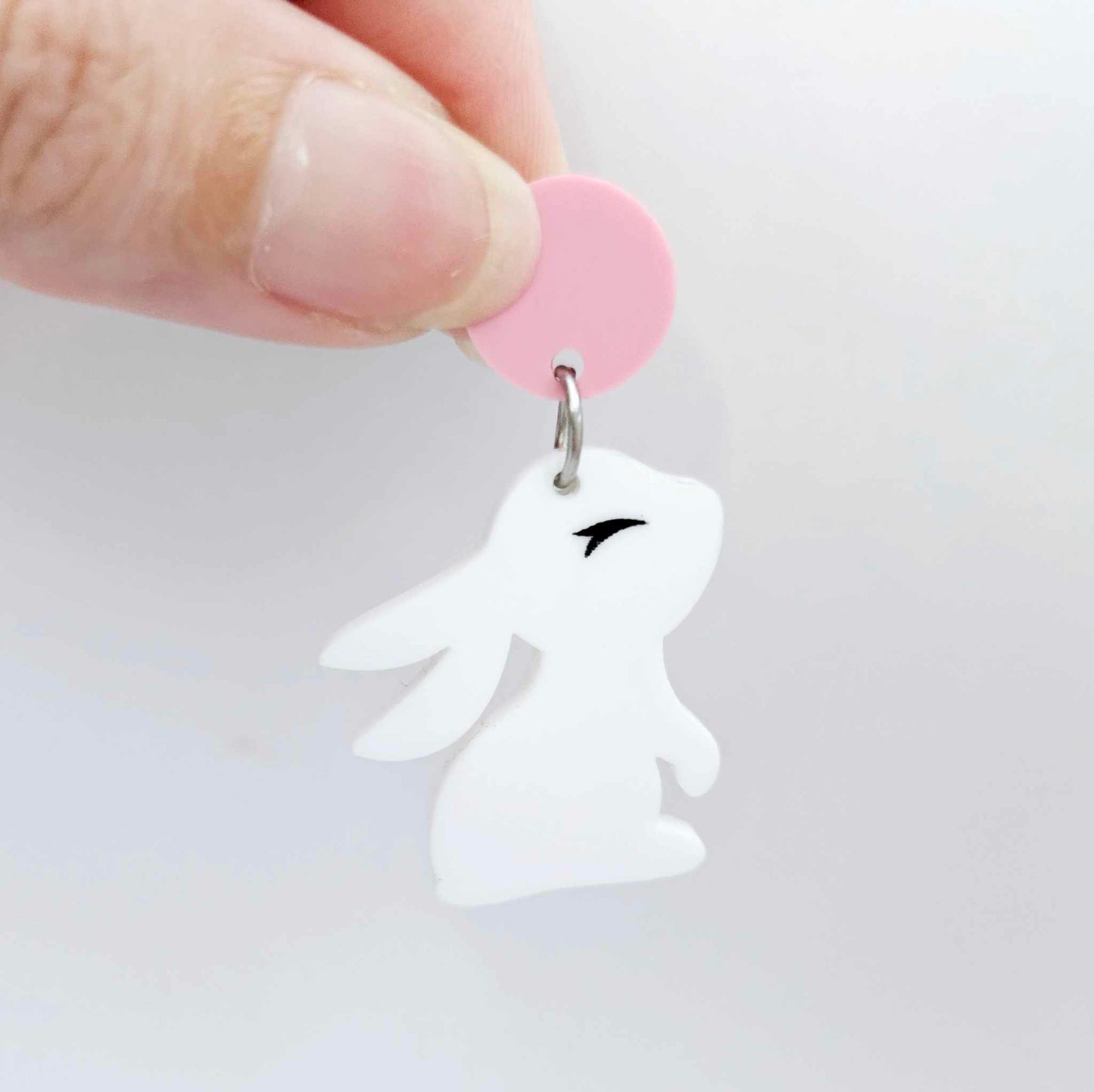 32mm white bunny dangle blanks showing paint filled black eyelashes hanging from 14mm pastel pink topper