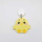 Pastel yellow acrylic chicken dangle hanging from a 14mm white acrylic topper, engraved chicken face with rosy cheeks paint filled