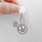 38mm silver glitter acrylic bunny dangle earring blank hanging from a 14mm white acrylic topper, bunny head with floppy ear and paint filled smiley face