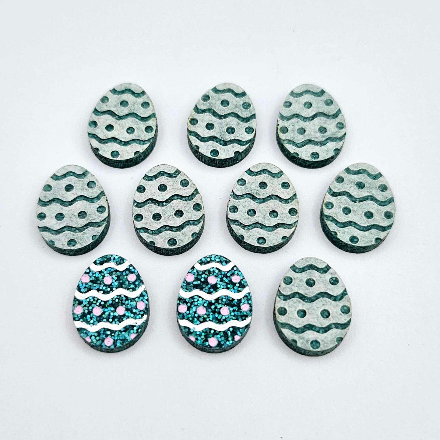 16mm teal glitter acrylic Easter egg stud blanks with engraved pattern and paint fill