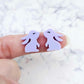 Close-up of pastel purple acrylic bunny stud blanks with paint filled eyelashes