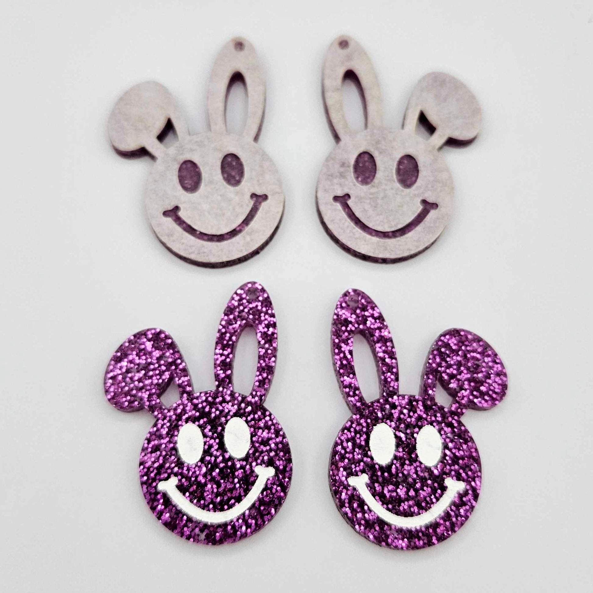 38mm purple glitter acrylic bunny dangle blanks with engraved smiley face, two paint filled white and two others unfilled with protective film on