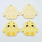 Pastel yellow acrylic chicken dangle blanks with engraved face and feet, two paint filled and two with protective film on