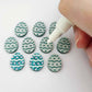 16mm teal glitter acrylic Easter egg stud blanks with engraved pattern and paint fill