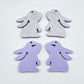 32mm pastel purple bunny dangle blanks showing paint filled black eyelashes on two pieces, with remaining pieces shown with protective paper as supplied