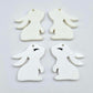 32mm white bunny dangle blanks showing paint filled black eyelashes on two pieces, with remaining pieces shown with protective paper as supplied