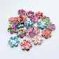 10mm chunky glitter flower stud blanks in mixed colours, shown as a pile of assorted mini acrylic flowers