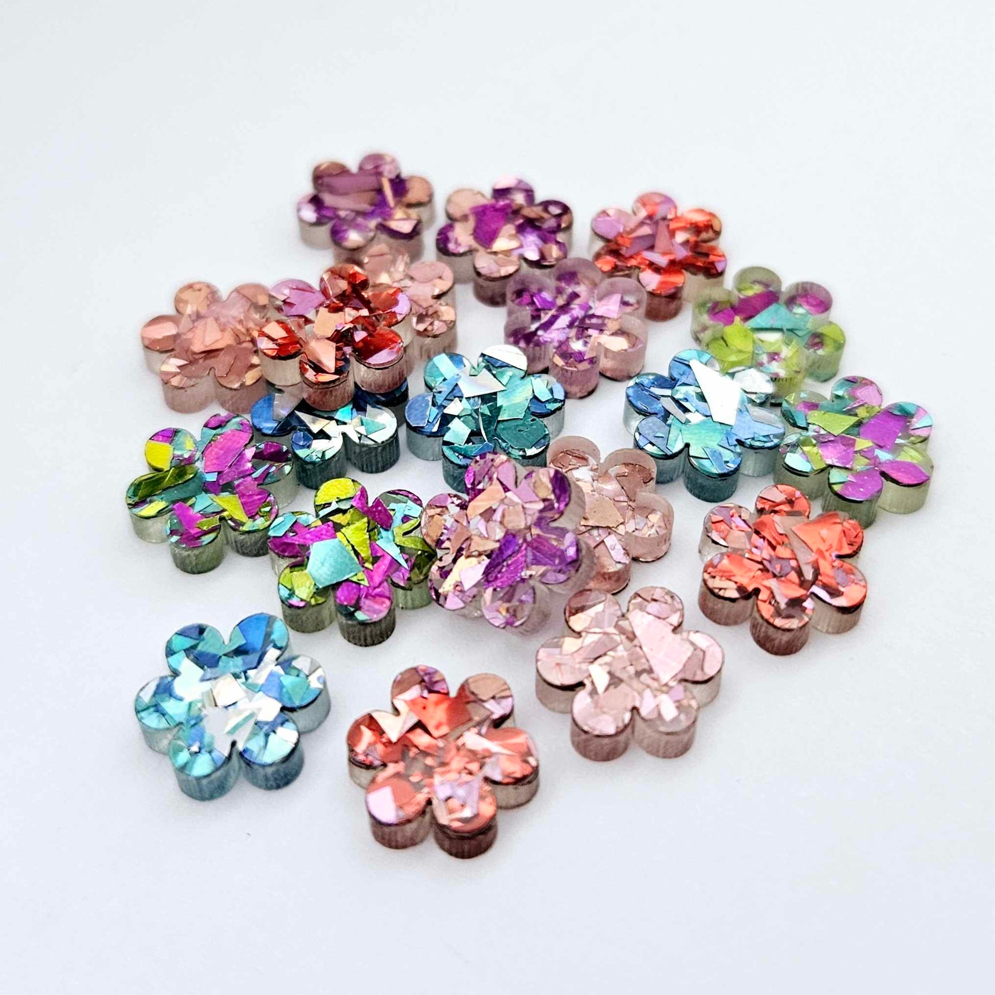 10mm chunky glitter flower stud blanks in mixed colours, shown as a pile of assorted mini acrylic flowers