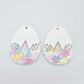 Two cracked egg acrylic earring blanks unassembled, white top halves and pastel pop UV printed bottom halves