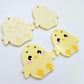 Pastel yellow acrylic chicken dangle blanks with engraved face and feet, two paint filled and two with protective film on