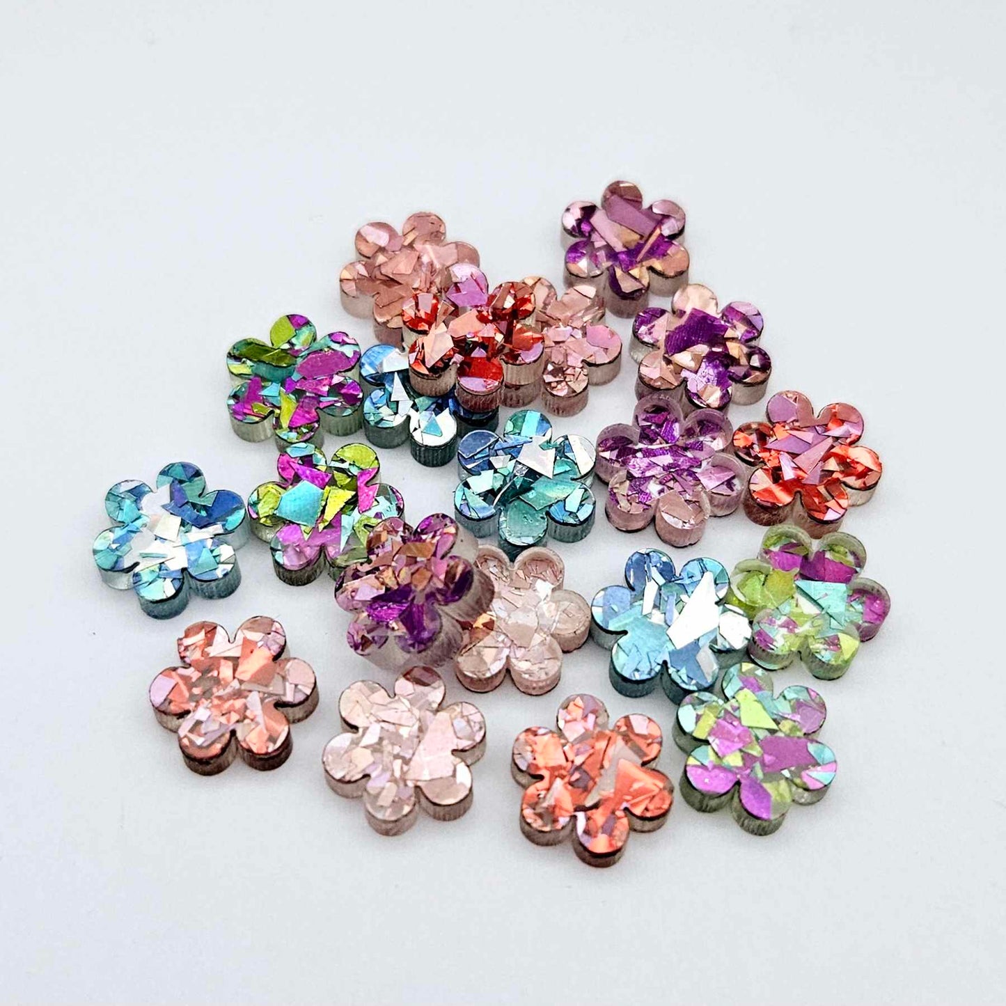 10mm chunky glitter flower stud blanks in mixed colours, shown as a pile of assorted mini acrylic flowers