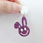 38mm purple glitter acrylic bunny dangle earring blank hanging from a 14mm white acrylic topper, bunny head with floppy ear and paint filled smiley face