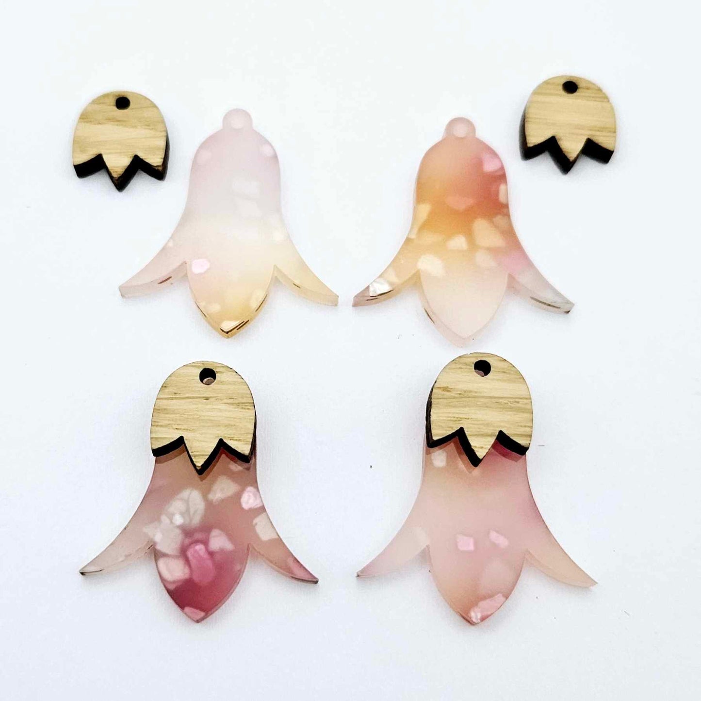 28mm frangipani petal acrylic nodding flower dangle blanks shown on their own and with oak wood leaf cap pieces
