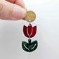 Assembled red marble and green mineral acrylic tulip dangle hanging from a 14mm oak wood topper, engraved detail paint filled white