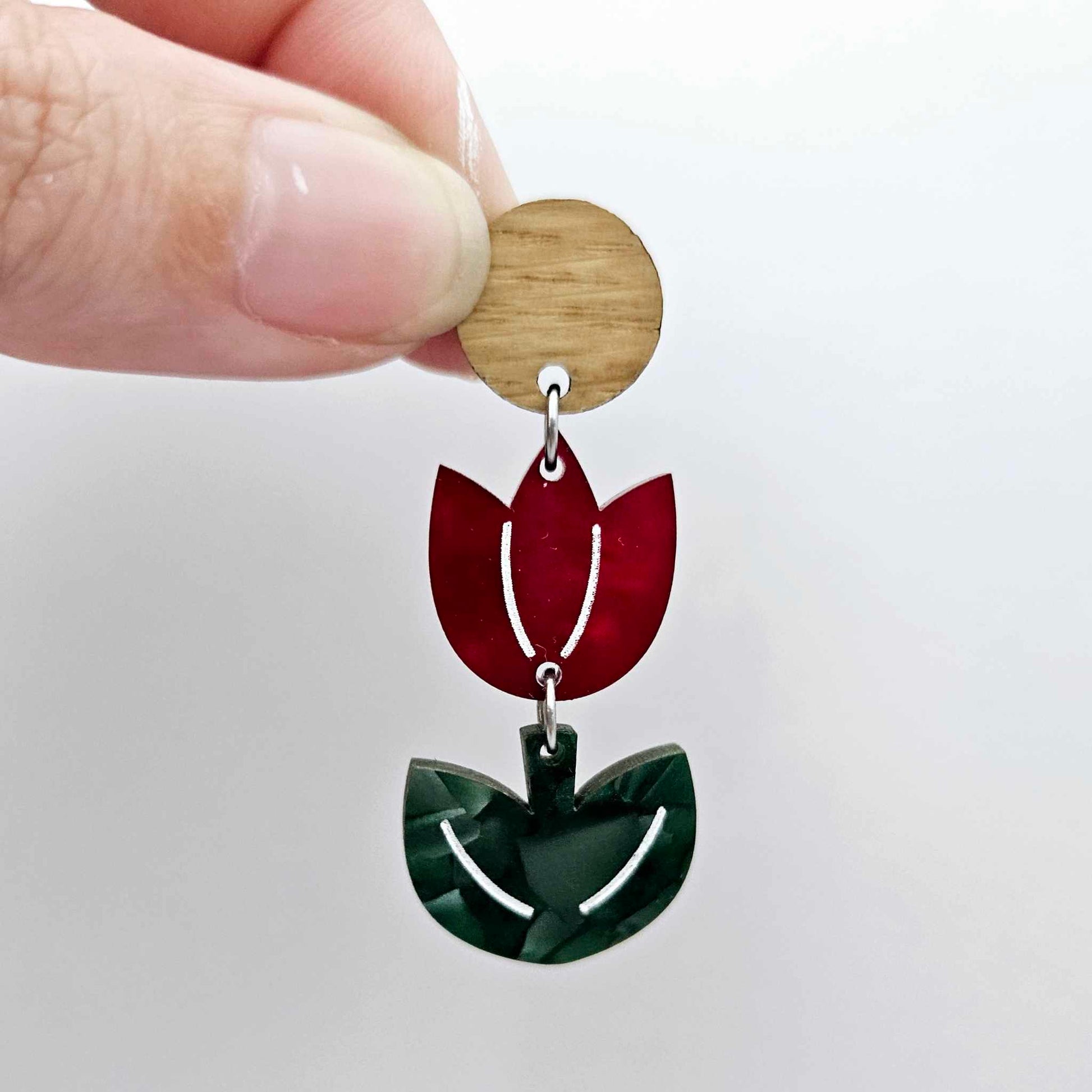 Assembled red marble and green mineral acrylic tulip dangle hanging from a 14mm oak wood topper, engraved detail paint filled white