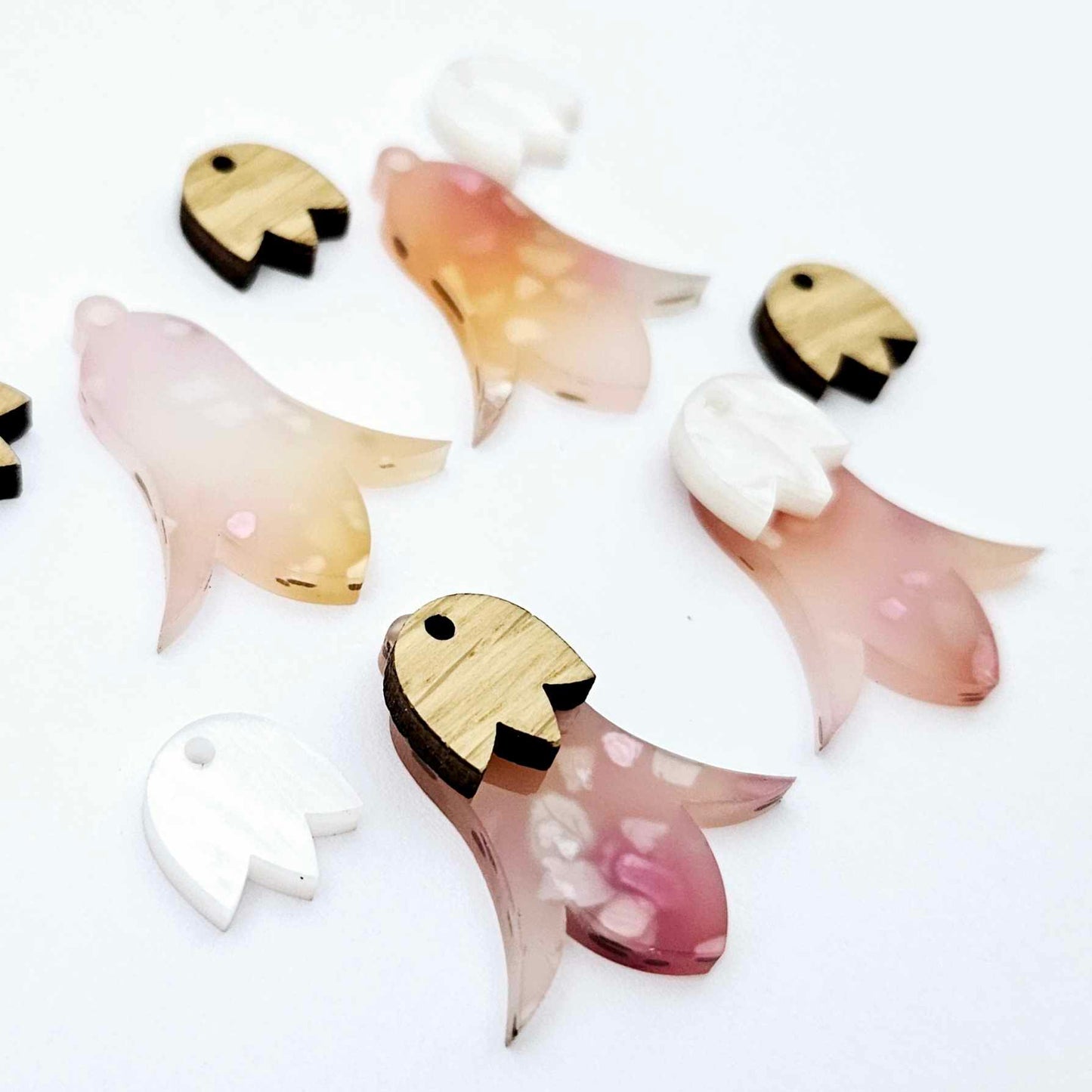 28mm frangipani petal acrylic nodding flower dangle blanks shown on their own and with oak wood and white marble leaf cap pieces