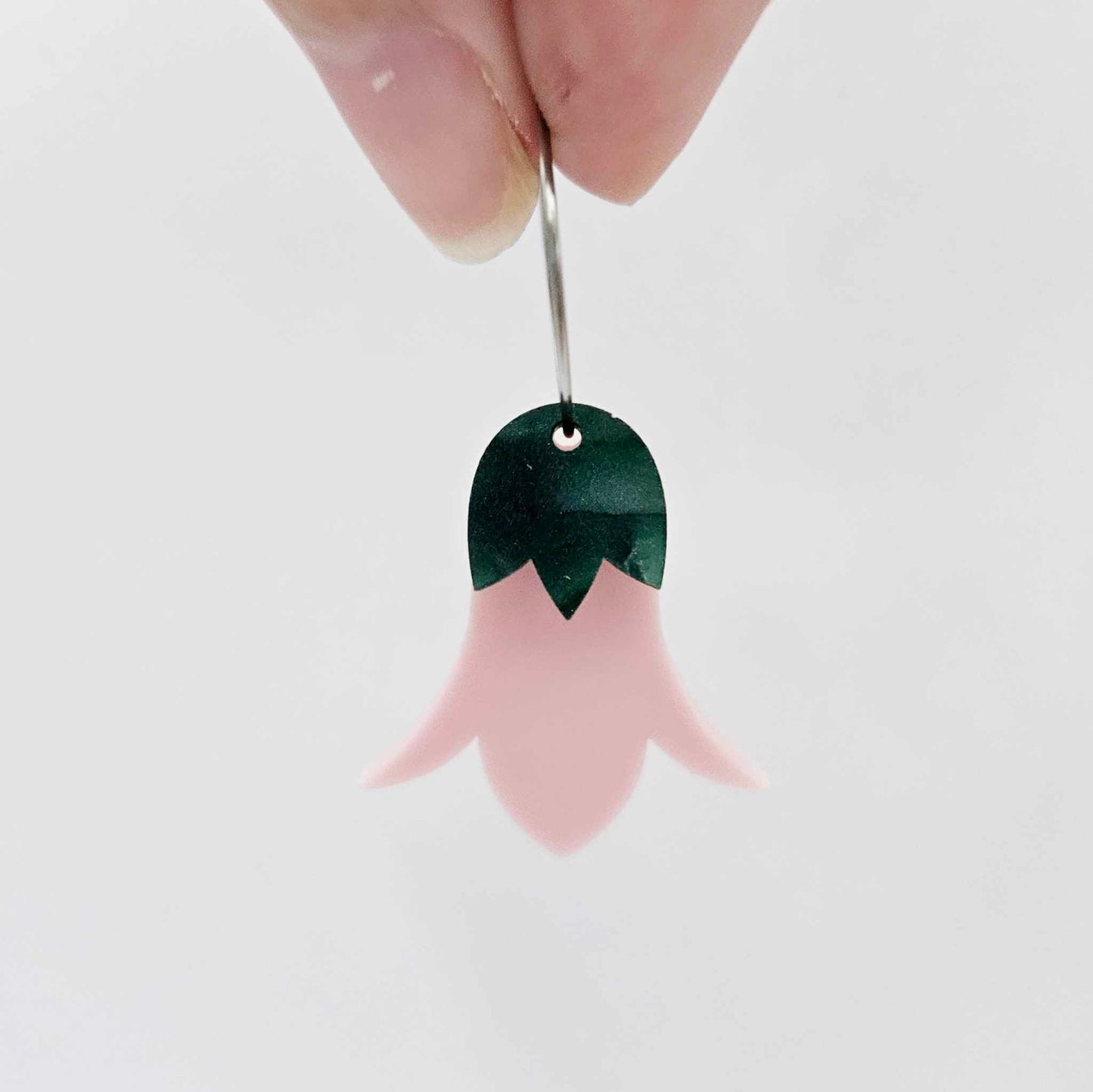Dusty pale pink nodding flower dangles assembled on 20mm hoops with leaf cap detail for a layered botanical flower look