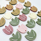 Two-piece tulip acrylic dangle blanks in a mixed pack of solid colours and olive green, paint filled white on some and remaining unfilled
