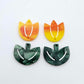 Two-piece tulip acrylic dangle blanks in orange artist swirl and green mineral acrylic, paint filled white on one pair
