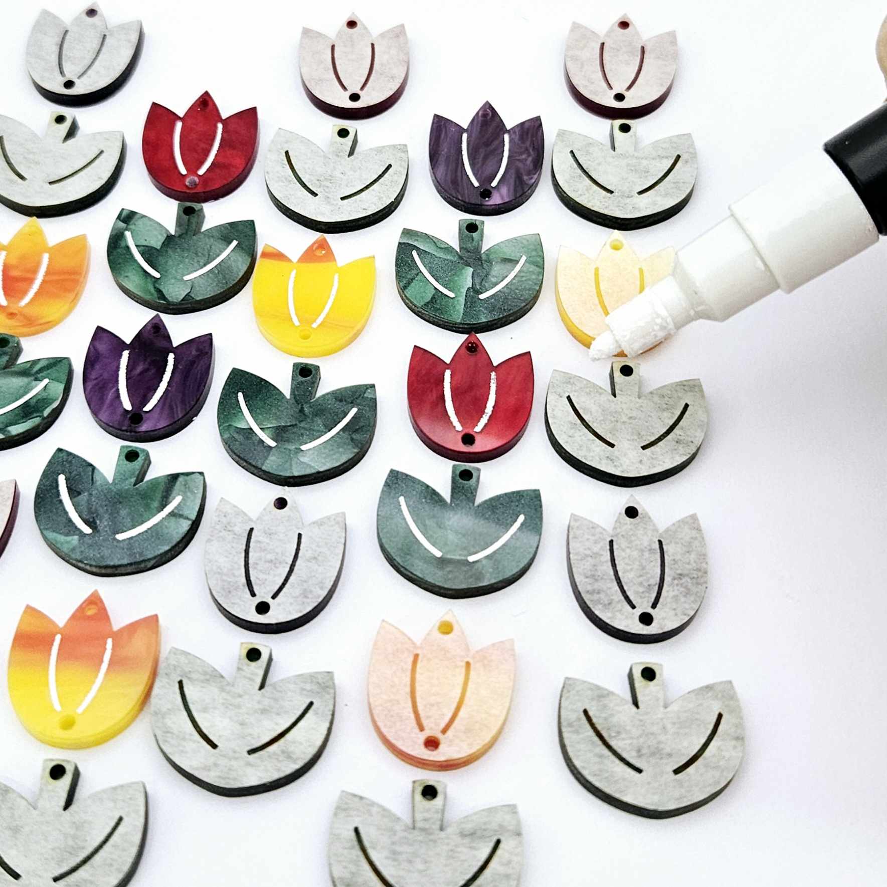 Two-piece tulip acrylic dangle blanks in marble and green mineral acrylic mixed pack, paint filled white on some with remaining unfilled