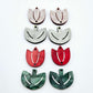 Two-piece tulip acrylic dangle blanks in red marble and green mineral acrylic, paint filled white on one pair with remaining pair unfilled