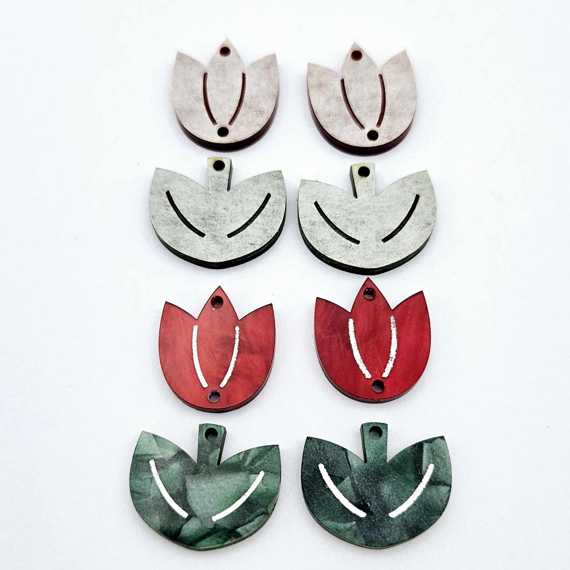 Two-piece tulip acrylic dangle blanks in red marble and green mineral acrylic, paint filled white on one pair with remaining pair unfilled