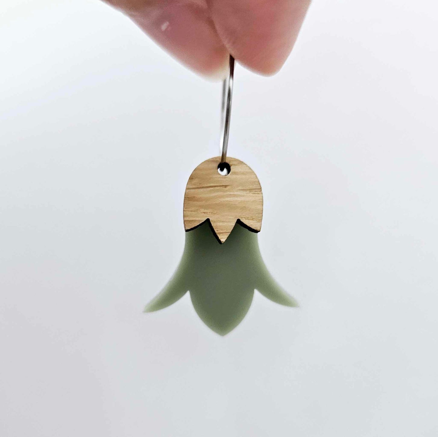 Olive green acrylic nodding flower dangle blanks assembled on 20mm hoops with leaf cap detail for a layered botanical flower look