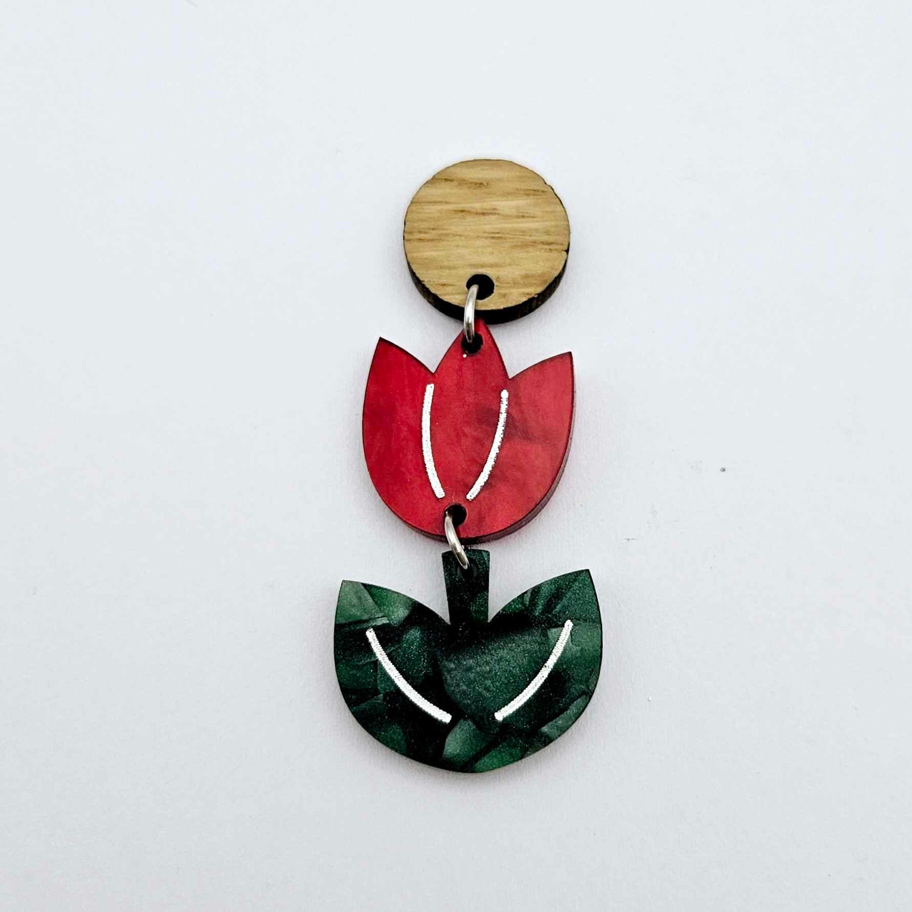 Assembled red marble and green mineral acrylic tulip dangle hanging from a 14mm oak wood topper, engraved detail paint filled white