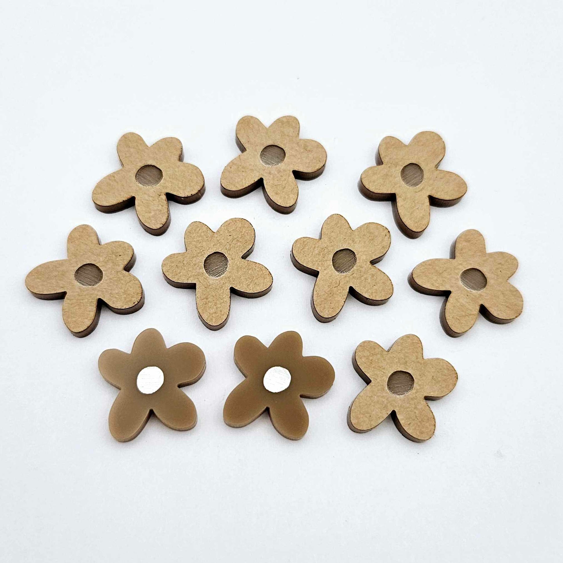 16mm iced coffee brown organic flower stud blanks with engraved centre, one pair paint filled white and several unfilled pieces shown with protective film on